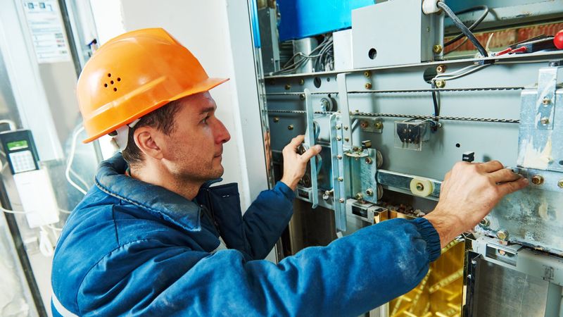 Technician installing commercial mechanical plant